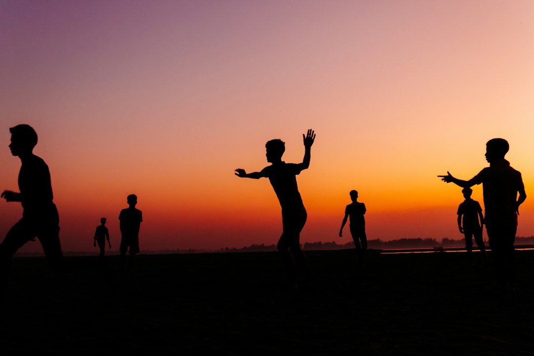 about-us-02 Silhouette of Children Playing on the Teesta Riverbed in Bangladesh